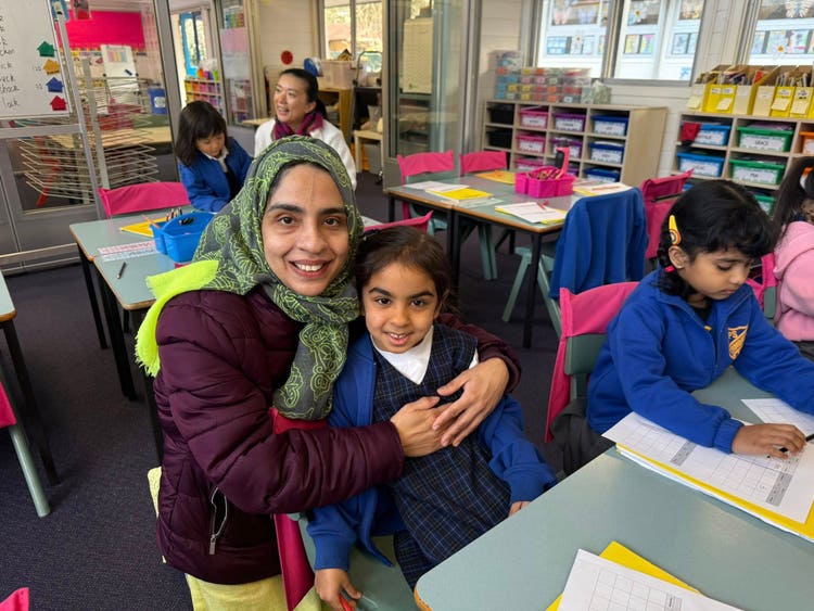 Parent and daughter in classroom