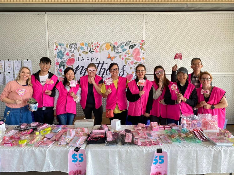 parents in vests celebrating mother's day