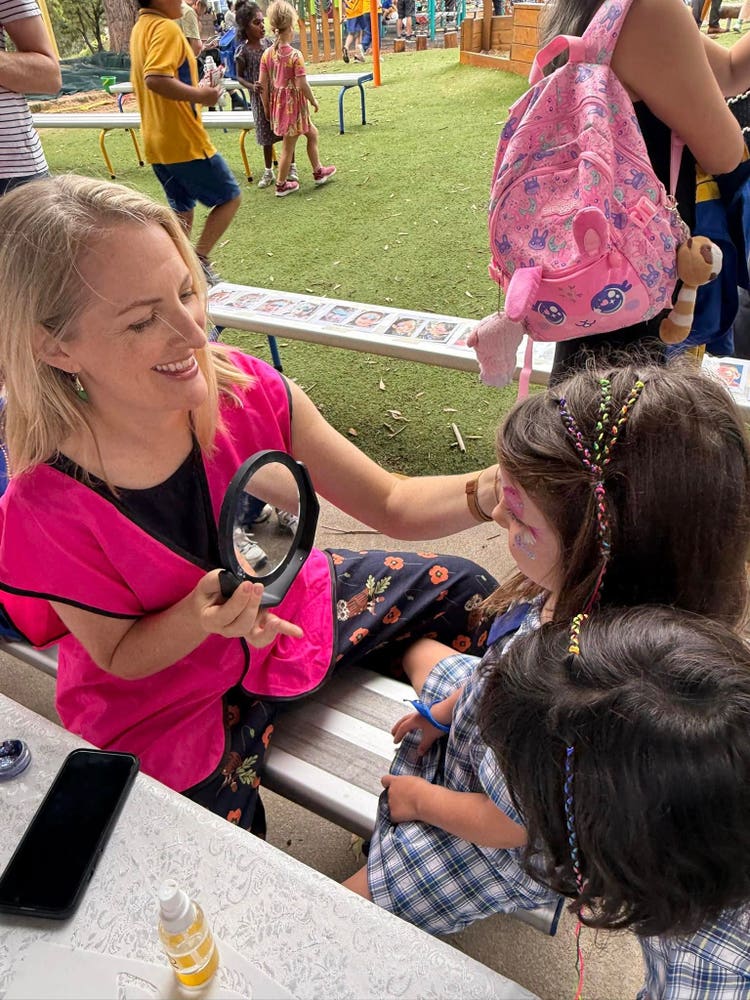 parent painting student's face