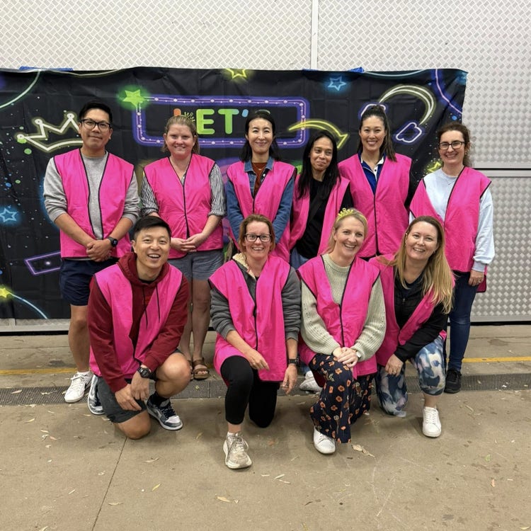 image of p and c members wearing pink vests at a school event