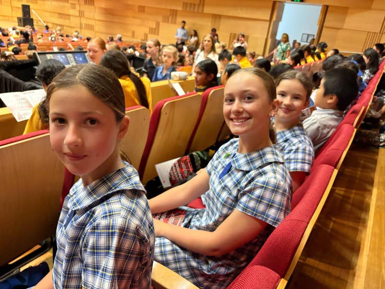 three student leaders smiling at the camera